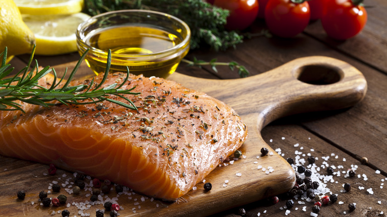 salmon filet on wooden board