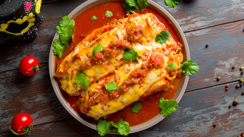 garnished red sauce enchiladas