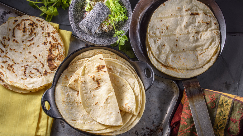 corn tortilla stacks and in pan