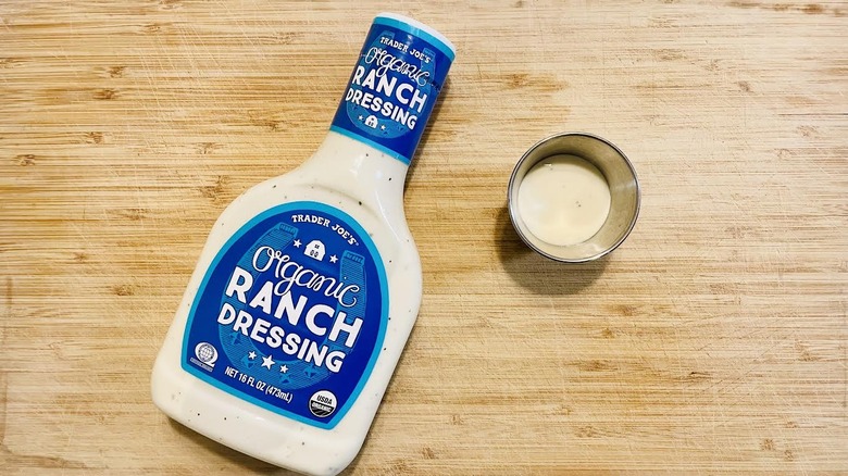 An image of Trader Joe's organic ranch dressing on a wooden table