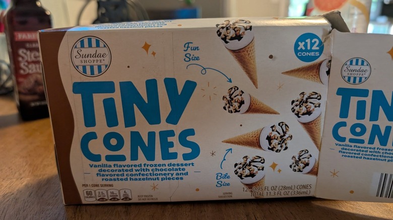 An open box of Aldi's Tiny Cones sit on a table