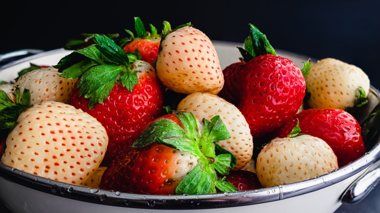 Pineberries and strawberries in bowl