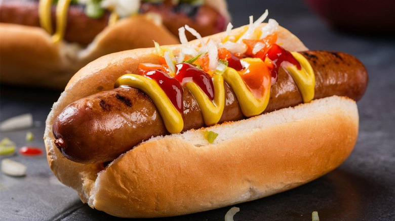 basic hot dog with ketchup and mustard and onions
