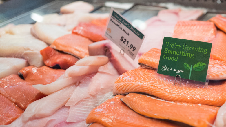 Salmon from Whole Foods Market is shown in a display case with price label.