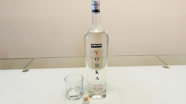 Bottle of Kirkland Signature French Vodka with glass on side