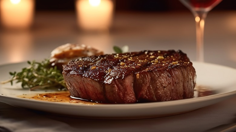 Rare steak on white plate