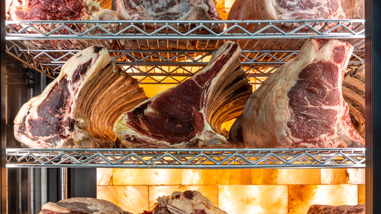 Meat on racks in dry aging locker