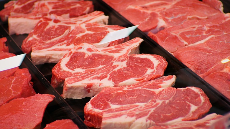 Raw ribeye steaks in display case