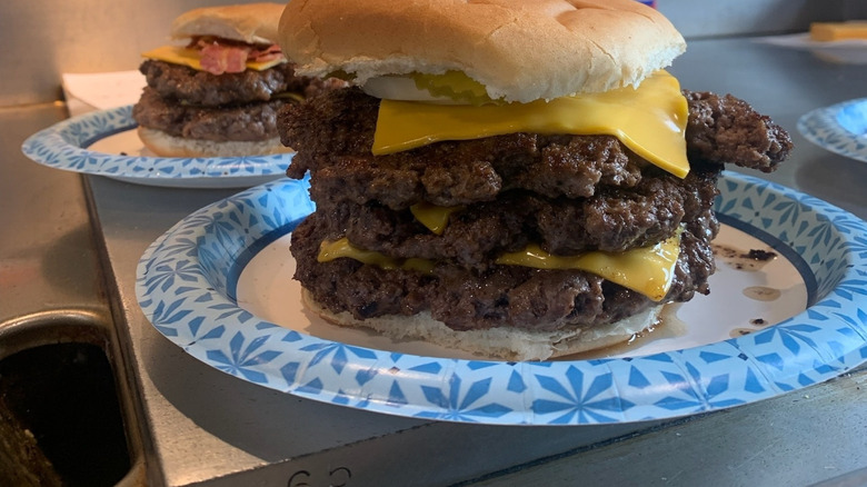 Triple Cheeseburger on a paper plate