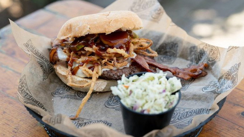 The White Oak BBQ Burger in a tray with cole slaw