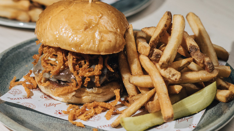 The Notch Burger with fries and a pickle