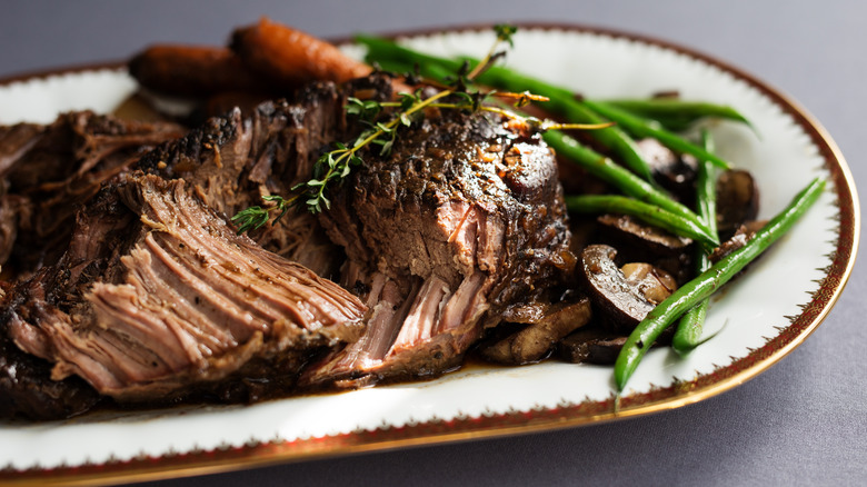 Tender roast beef on plate