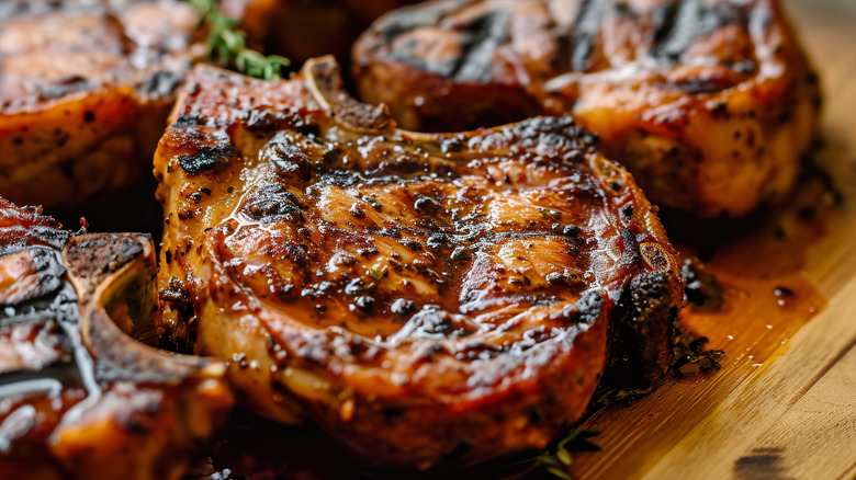 Grilled pork chops served with BBQ sauce