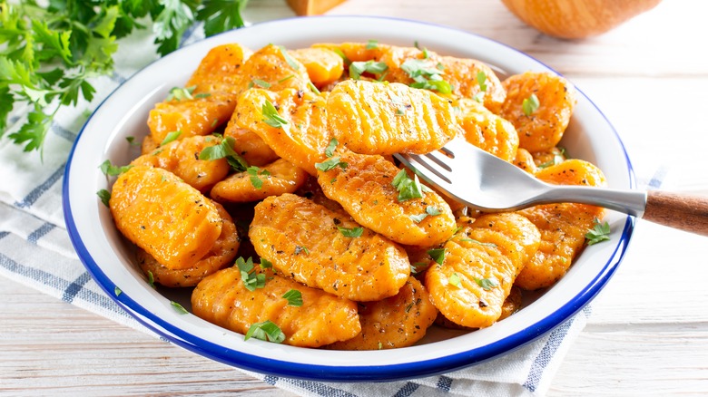 orange gnocchi in a bowl