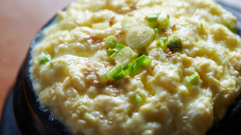 gyeran jjim steamed eggs topped with sesame and sliced scallion
