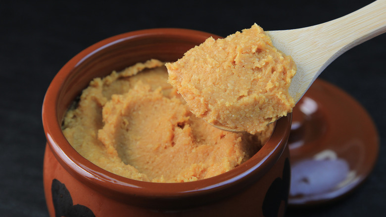Jar of white miso paste with spoon