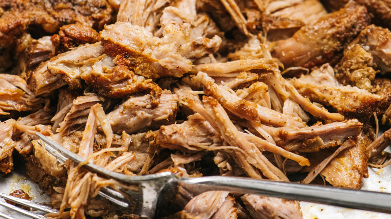 Slow-cooked braised pork with forks