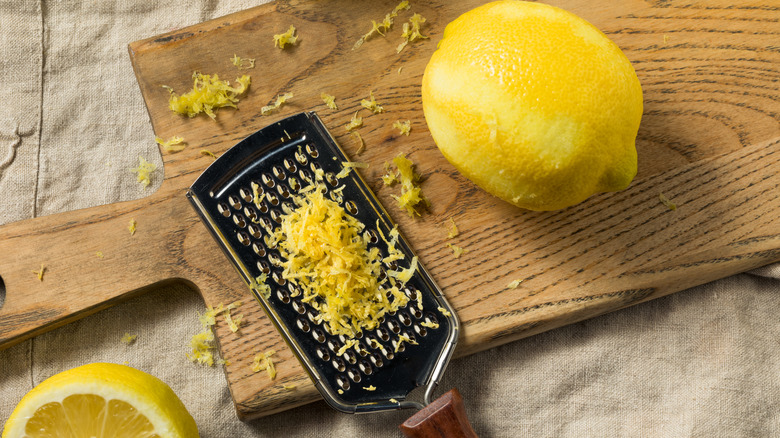 Zesting a lemon on a cutting board