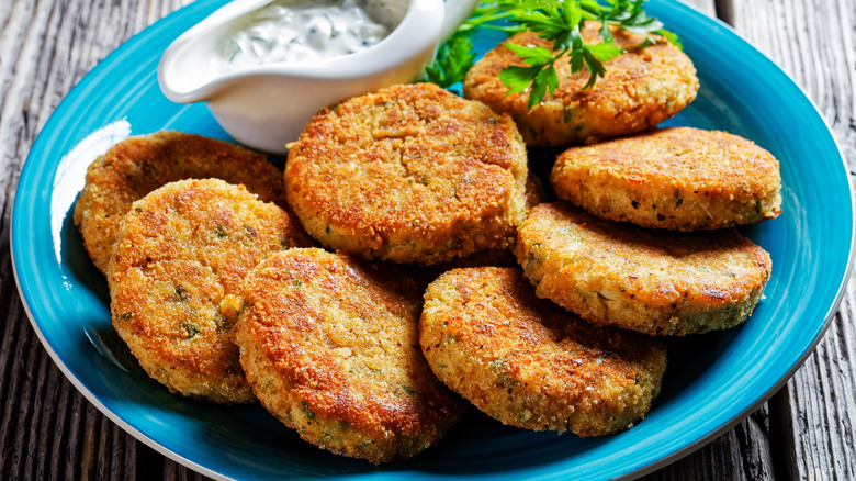Blue plate of fried fish cakes