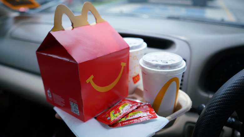 McDonald's meal with a drink inside a car