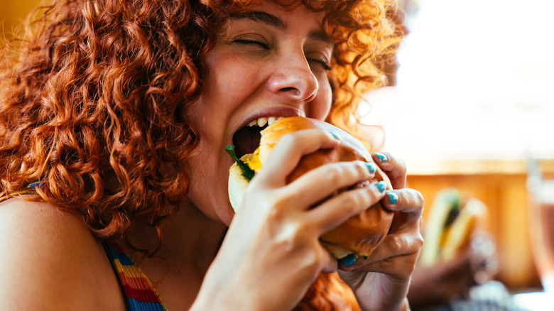 Person eating a burger