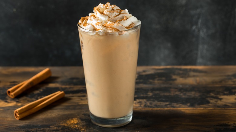 homemade pumpkin spice latte with cinnamon sticks