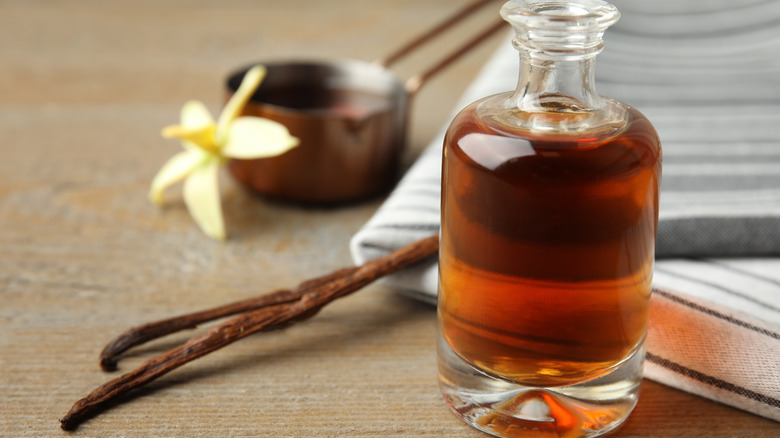 Vanilla bean and extract in glass bottle