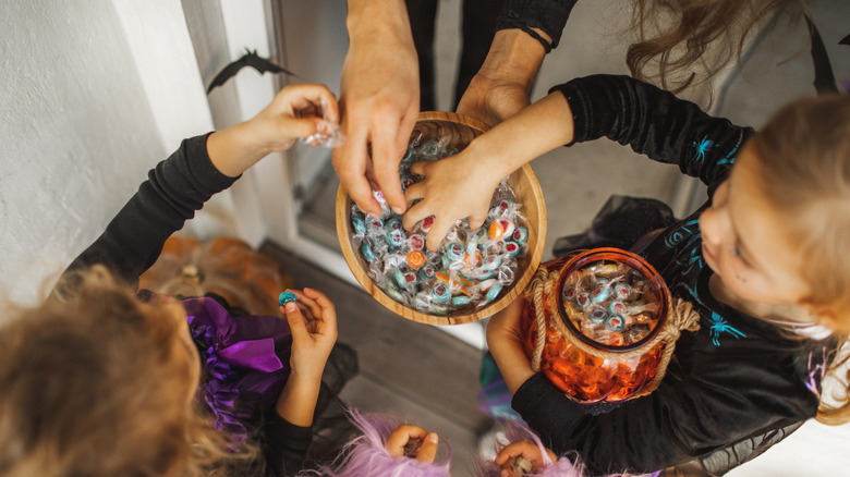 Kids getting candy on Halloween