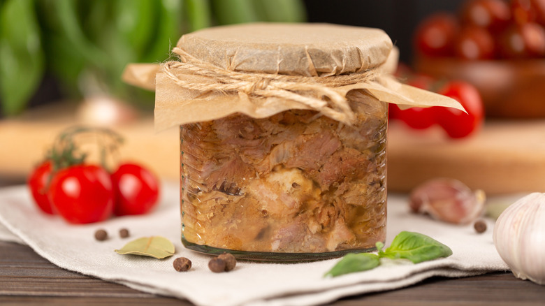 Pork meat canned in a glass jar
