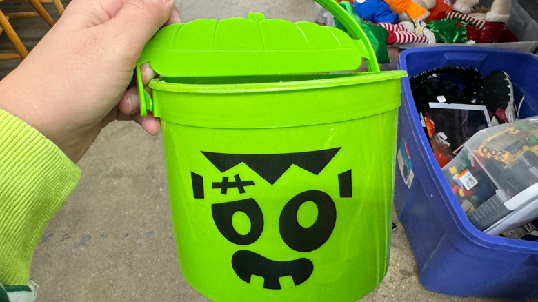 person holding McDonald's Halloween bucket