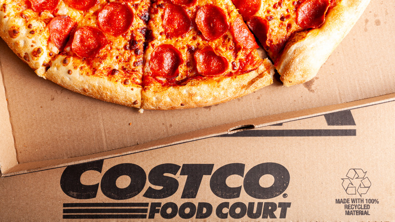 Pizza slices in a cardboard Costco Food Court box, with the logo visible