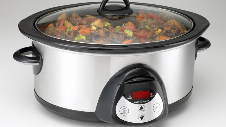 slow cooker cooking vegetables and meat
