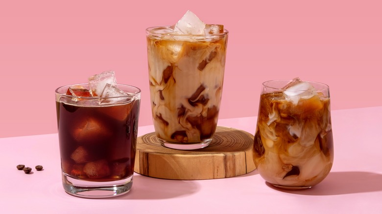 Assorted iced coffees before pink background