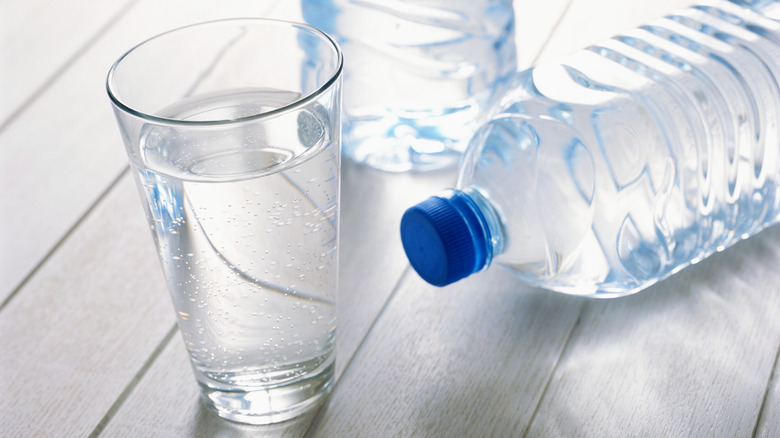 water bottles and glass of water