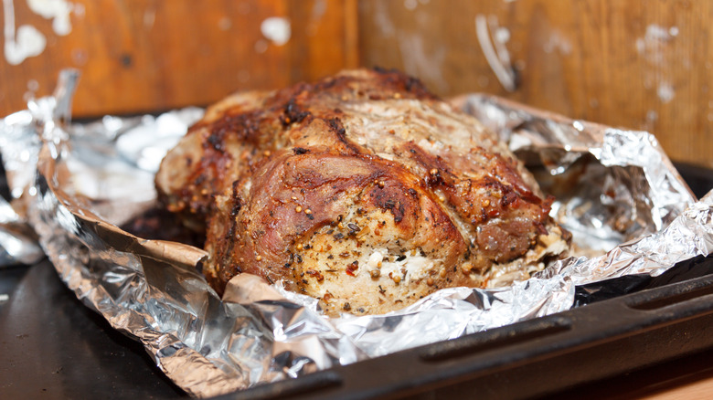 Cooked beef roast laying on foil