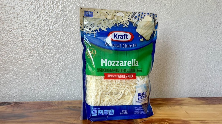 A close-up of a bag of Kraft Whole Milk Shredded Natural Mozzarella Cheese