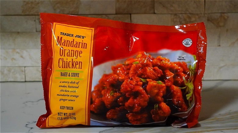 A bag of Mandarin Orange Chicken from TJ's sits on a counter top