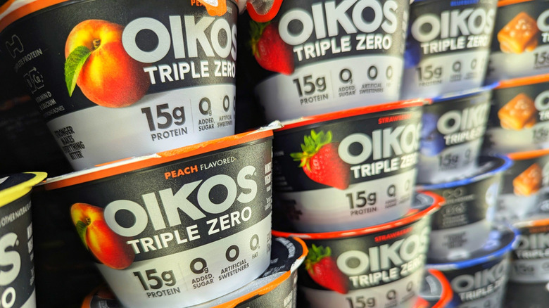 Closeup of stacks of containers of Oikos Triple Zero yogurt.