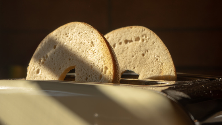 Sliced bagel in a toaster