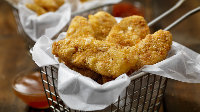 metal basket of chicken fingers