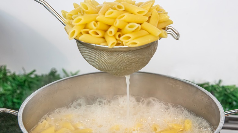 Cooking pasta over the stove