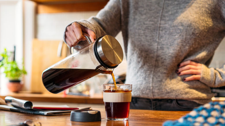person pouring homemade cold brew