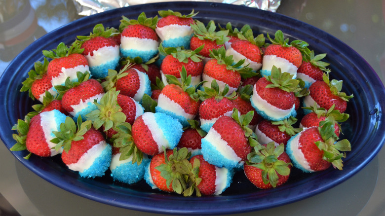 Strawberries dipped in white chocolate and blue sugar.