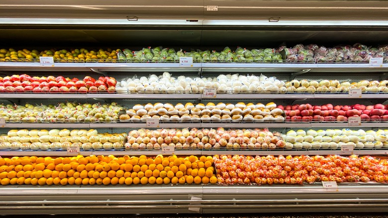 Colorful produce neatly arranged on shelves
