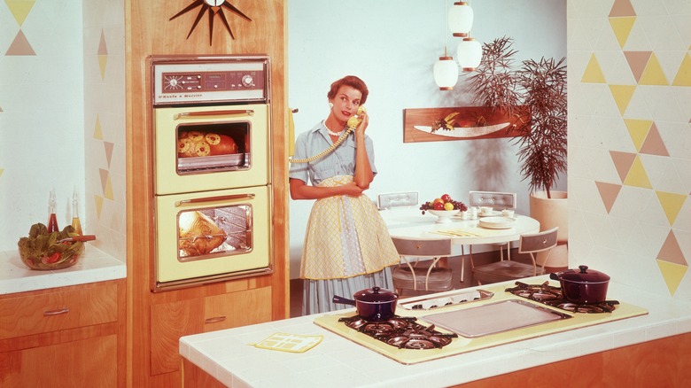 Woman in an old-fashioned kitchen
