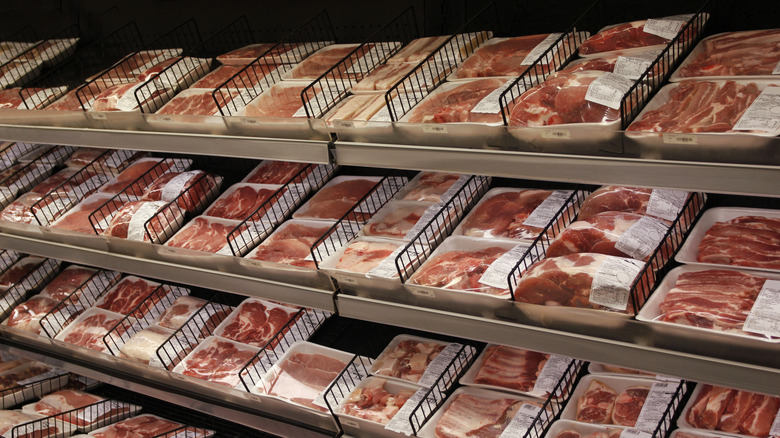 Steaks are displayed in a grocery store meat department