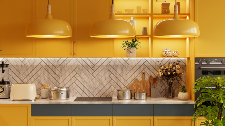 A yellow kitchen with vintage fixtures