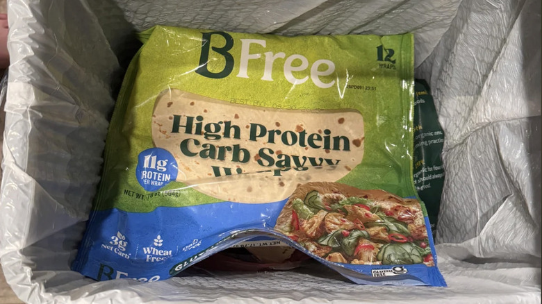A package of BFree High Protein Gluten-Free Wraps in the trash