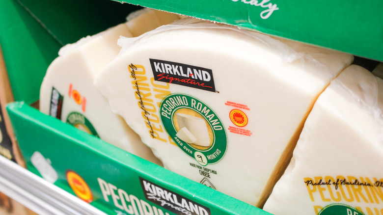 wheels of kirkland pecorino romano in display box at costco