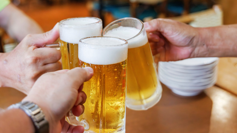 Drinking beer in restaurant.